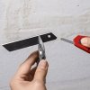 Nóż z odłamywanym ostrzem Knipex CutiX 90 10 165 BK