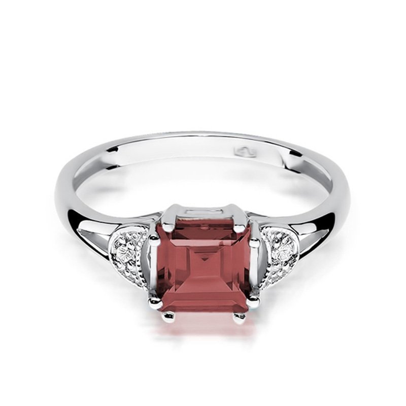 Pierścionek złoty 585 z brylantami 0,06ct granatem 1,30ct W-40B
