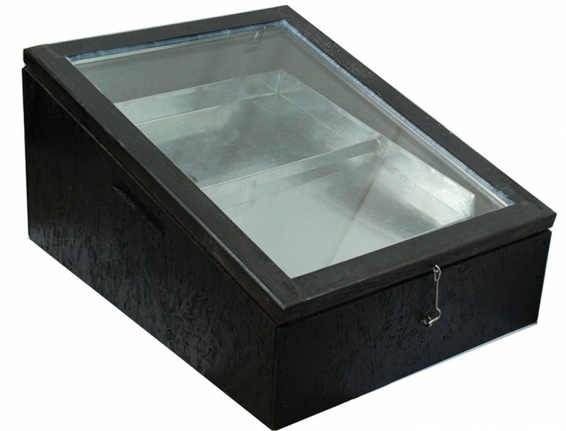 Solar wax melter with a wooden body