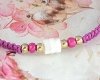 GOLDENES ARMBAND MIT EDELSTAHL