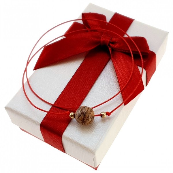 GOLDENES ARMBAND MIT EDELSTAHL