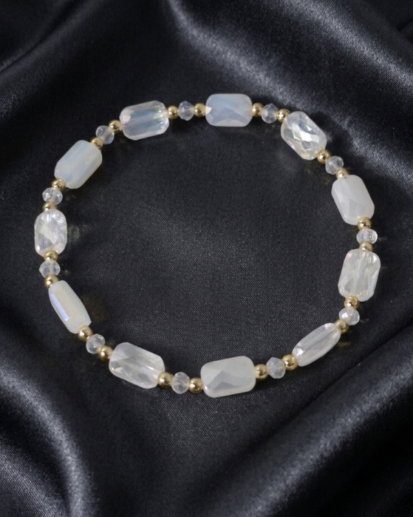 673 Bransoletka pozłacana 14k na gumce kryształki