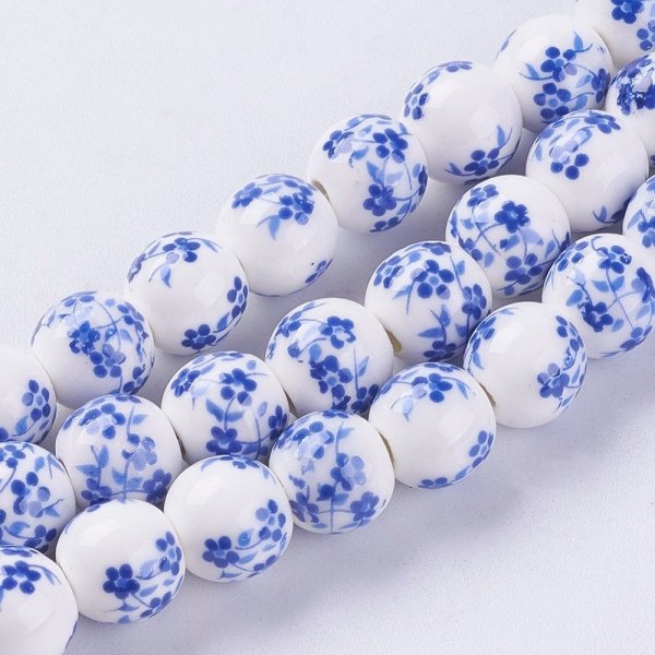697a Koraliki ceramiczne z nadrukiem kwiatowym, okrągłe 8-8,5 mm, otwór: 2 mm, sznur ok 33cm