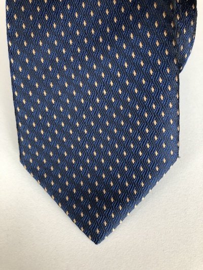 Cravatta blu con punta spillo marroni
