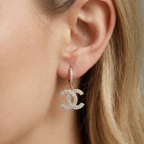 Okazałe kolczyki splecione litery złoto 585