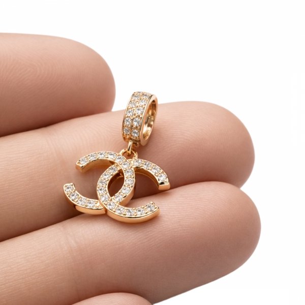 Wisior splecione litery złoto 585