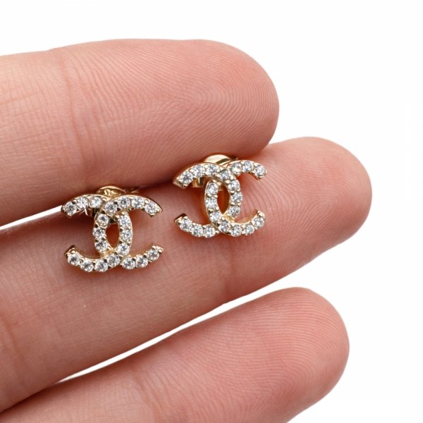 Kolczyki sztyft o splecionej formie z białymi kamieniami złoto 585 