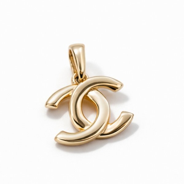 Wisior ze splecionymi literami złoto 585