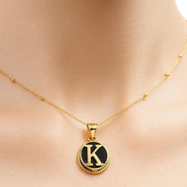 Wisior inicjał litera K koło czarne złoto 585 