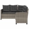 Sofa ogrodowa ze stołem i poduszkami w kształcie litery L
