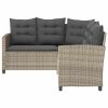 Sofa ogrodowa ze stołem i poduszkami w kształcie litery L